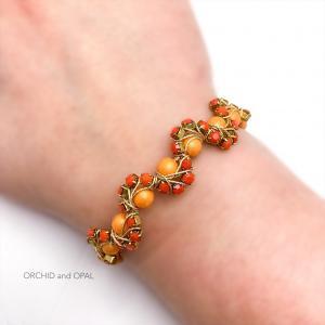orange wavy memory wire cup chain beaded bracelet